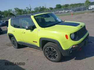 2017 Jeep Renegade Trailhawk z VIN ZACCJBCB0HPF27223, wystawiony jako IAAI lot #42279998 z przebiegiem 166 836 mil mil oraz . Historia ofert i sprzedaży dostępna na DreamBid. Obrazek 1.