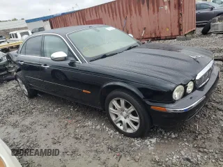 2004 Jaguar XJ VDP with VIN SAJWA74C64SG27143, listed as a Copart auction lot 71373744 with 129,942 mi miles and Salvage Title. Bid and sale history available at carsss.com. Image 4.