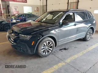 2023 Volkswagen Tiguan S z VIN 3VVRB7AX6PM069001, wystawiony jako IAAI lot #41193316 z przebiegiem 21 586 mil mil oraz . Historia ofert i sprzedaży dostępna na DreamBid. Obrazek 21.