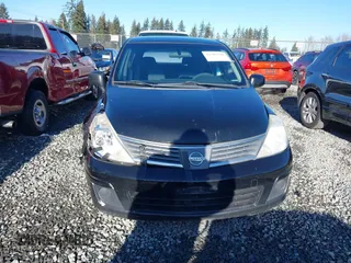 2009 Nissan Versa 1.8 SL with VIN 3N1BC13E59L406937, listed as a IAAI auction lot 41387158 with 149,234 mi miles. Bid and sale history available at carsss.com. Image 12.