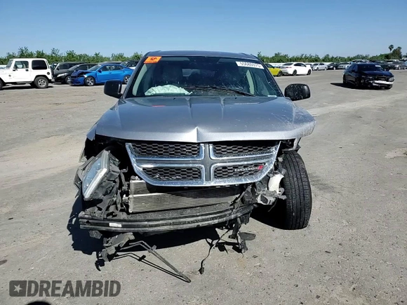 2015 Dodge Journey American Value with VIN 3C4PDCABXFT712192, listed as a Copart auction lot 55680975 with 104,579 mi miles and Salvage Title. Bid and sale history available at DreamBid. Image 14.