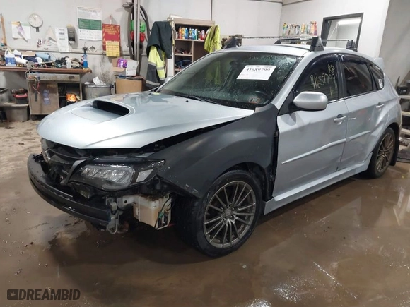 2013 Subaru Impreza Wagon WRX WRX with VIN JF1GR7E61DG853648, listed as a IAAI auction lot 41689799 with 124,193 mi miles. Bid and sale history available at carsss.com. Image 2.