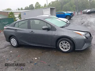 2016 Toyota Prius Two z VIN JTDKBRFU7G3000989, wystawiony jako IAAI lot #42345088 z przebiegiem 117 427 mil mil oraz . Historia ofert i sprzedaży dostępna na DreamBid. Obrazek 13.