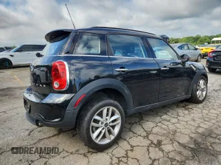 2014 MINI Countryman S with VIN WMWZC3C56EWP25479, listed as a Copart auction lot 61197525 with 101,146 mi miles and Salvage title. Bid and sale history available at DreamBid. Image 3.