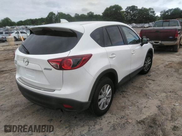 2014 Mazda CX-5 Touring z VIN JM3KE4CY0E0303748, wystawiony jako IAAI lot #42127406 z przebiegiem Nie podano mil oraz . Historia ofert i sprzedaży dostępna na DreamBid. Obrazek 4.