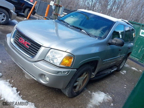 2004 GMC Envoy SLE with VIN 1GKDS13SX42134642, listed as a IAAI auction lot 41715419 with 173,661 mi miles. Bid and sale history available at carsss.com. Image 2.