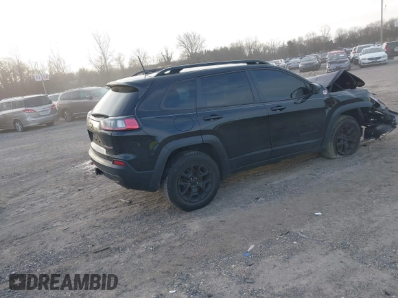 2022 Jeep Cherokee Trailhawk with VIN 1C4PJMBX0ND548397, listed as a IAAI auction lot 41240303 with 54,055 mi miles. Bid and sale history available at carsss.com. Image 4.