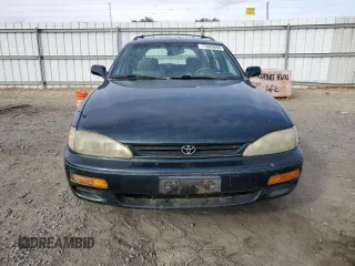 1995 Toyota Camry LE z VIN 4T1GK12W4SU079938, wystawiony jako Copart lot #77065084 z przebiegiem 222 731 mil mil oraz Szkoda całkowita • Salvage title. Historia ofert i sprzedaży dostępna na DreamBid. Obrazek 5.