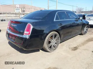 2014 Chrysler 300 with VIN 2C3CCAAG3EH285743, listed as a IAAI auction lot 41773664 with 182,034 mi miles. Bid and sale history available at carsss.com. Image 4.