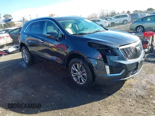 2021 Cadillac XT5 AWD Premium Luxury z VIN 1GYKNDRSXMZ170187, wystawiony jako IAAI lot #40965148 z przebiegiem 30 294 mil mil oraz . Historia ofert i sprzedaży dostępna na DreamBid. Obrazek 1.