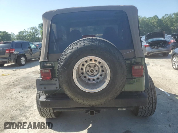 1999 Jeep Wrangler Sahara with VIN 1J4FY49S6XP478675, listed as a Copart auction lot 52147605 with 157,971 mi miles and Salvage Title. Bid and sale history available at carsss.com. Image 6.
