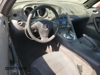 2008 Pontiac Solstice z VIN 1G2MC35B68Y122125, wystawiony jako Copart lot #60517155 z przebiegiem 211 877 mil mil oraz Czysty tytuł • Clean title. Historia ofert i sprzedaży dostępna na DreamBid. Obrazek 8.