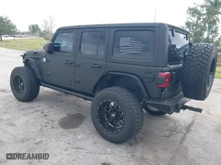 2018 Jeep Wrangler Unlimited Sport S with VIN 1C4HJXDG2JW228483, listed as a IAAI auction lot 41710364 with 56,970 mi miles. Bid and sale history available at carsss.com. Image 3.