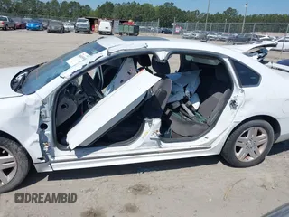 2014 Chevrolet Impala LT with VIN 2G1WB5E30E1136153, listed as a IAAI auction lot 39848599 with 126,676 mi miles and . Bid and sale history available at DreamBid. Image 6.