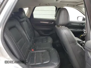 2021 Mazda CX-5 Grand Touring z VIN JM3KFADM7M1339081, wystawiony jako Copart lot #58913585 z przebiegiem Nie podano mil oraz Szkoda całkowita • Salvage title. Historia ofert i sprzedaży dostępna na DreamBid. Obrazek 11.