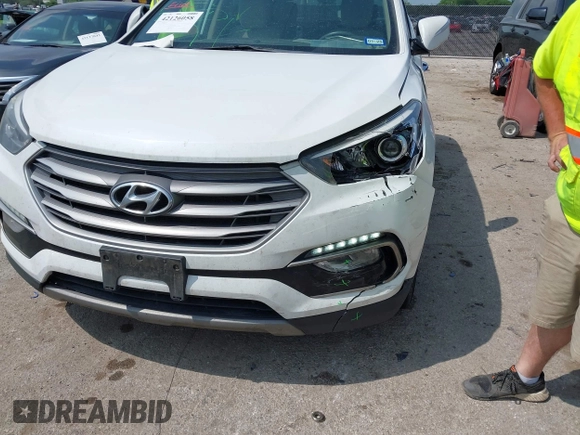 2018 Hyundai Santa Fe 2.4L z VIN 5NMZUDLB3JH055771, wystawiony jako IAAI lot #42126058 z przebiegiem 142 991 mil mil oraz . Historia ofert i sprzedaży dostępna na DreamBid. Obrazek 6.
