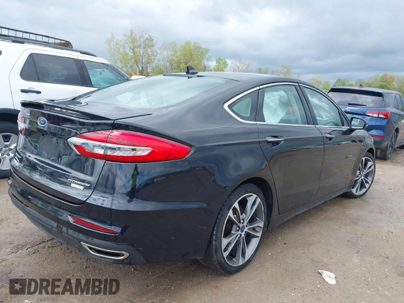 2019 Ford Fusion Titanium with VIN 3FA6P0K92KR248521, listed as a IAAI auction lot 42198307 with 51,844 mi miles and . Bid and sale history available at DreamBid. Image 4.