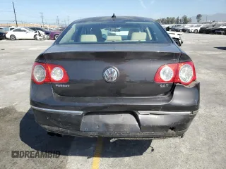 2010 Volkswagen Passat Komfort with VIN WVWJK7ANXAE129739, listed as a Copart auction lot 57798275 with 155,830 mi miles and Salvage title. Bid and sale history available at DreamBid. Image 6.