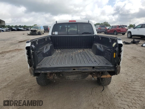 2013 Toyota Tacoma z VIN 5TFMU4FN1DX016379, wystawiony jako Copart lot #57460865 z przebiegiem 174 821 mil mil oraz Szkoda całkowita • Salvage title. Historia ofert i sprzedaży dostępna na DreamBid. Obrazek 6.
