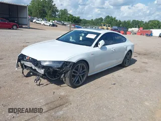 2016 Audi A7 Premium Plus with VIN WAUWGAFC2GN021696, listed as a IAAI auction lot 42595234 with 112,464 mi miles and . Bid and sale history available at DreamBid. Image 2.
