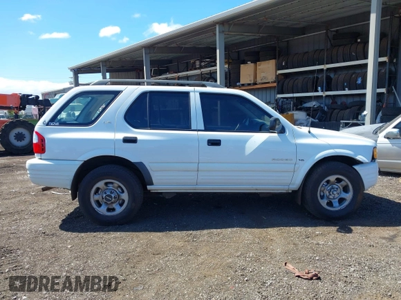 2000 Isuzu Rodeo S with VIN 4S2CK58W6Y4355597, listed as a IAAI auction lot 41775764 with 122,776 mi miles. Bid and sale history available at carsss.com. Image 13.
