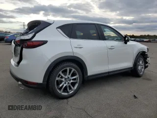 2021 Mazda CX-5 Signature with VIN JM3KFBEY5M0421694, listed as a Copart auction lot 85709714 with 28,126 mi miles and Salvage Title. Bid and sale history available at carsss.com. Image 3.