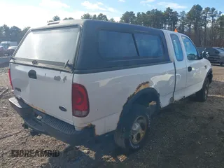 2003 Ford F-150 XL with VIN 2FTRX18W43CA62452, listed as a IAAI auction lot 41497879 with 125,828 mi miles. Bid and sale history available at carsss.com. Image 4.