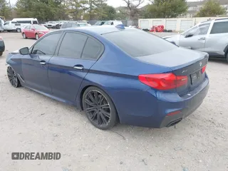 2018 BMW 5 Series M550i xDrive with VIN WBAJB9C56JG463891, listed as a IAAI auction lot 41731556 with 104,860 mi miles. Bid and sale history available at carsss.com. Image 3.