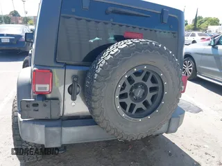 2016 Jeep Wrangler Unlimited Sport z VIN 1C4BJWDG7GL229364, wystawiony jako IAAI lot #42239069 z przebiegiem 87 001 mil mil oraz . Historia ofert i sprzedaży dostępna na DreamBid. Obrazek 16.