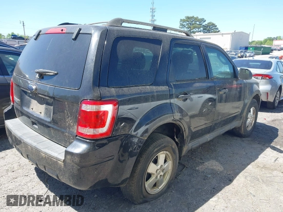 2011 Ford Escape XLT with VIN 1FMCU0D7XBKA54899, listed as a IAAI auction lot 42035816 with 180,770 mi miles. Bid and sale history available at carsss.com. Image 4.