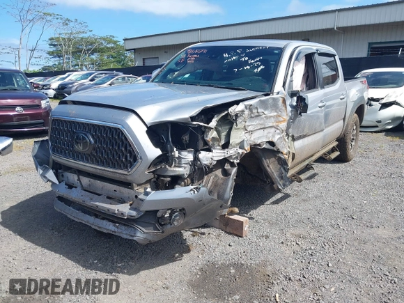 2018 Toyota Tacoma SR z VIN 3TMCZ5AN7JM156092, wystawiony jako IAAI lot #41642391 z przebiegiem 65 805 mil mil oraz . Historia ofert i sprzedaży dostępna na DreamBid. Obrazek 22.