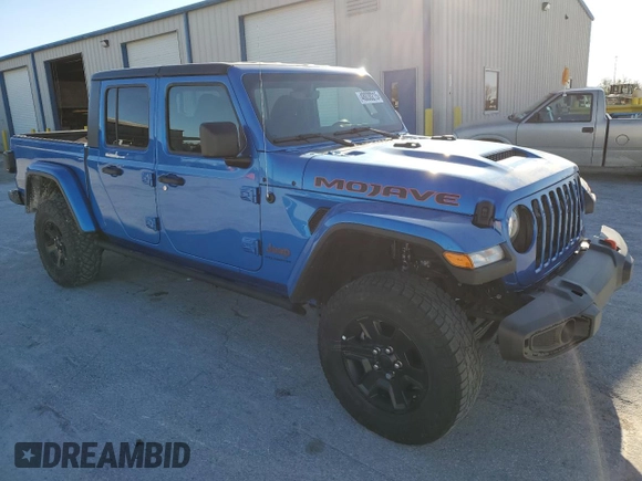 2023 Jeep Gladiator Mojave with VIN 1C6JJTEG7PL580727, listed as a Copart auction lot 48030215 with 12,707 mi miles and Salvage title. Bid and sale history available at DreamBid. Image 4.