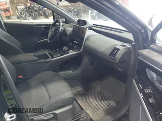 2024 Subaru Solterra Touring with VIN JTMABABA9RA052065, listed as a IAAI auction lot 42648692 with 13,880 mi miles and . Bid and sale history available at DreamBid. Image 5.