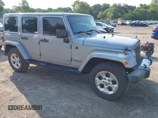 2015 Jeep Wrangler Unlimited Sahara z VIN 1C4BJWEG9FL570780, wystawiony jako IAAI lot #42474940 z przebiegiem 116 226 mil mil oraz . Historia ofert i sprzedaży dostępna na DreamBid. Obrazek 1.