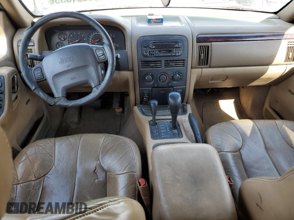 2000 Jeep Grand Cherokee Laredo with VIN 1J4GW48S6YC304447, listed as a Copart auction lot 58001035 with Not provided miles and Clean title. Bid and sale history available at DreamBid. Image 8.