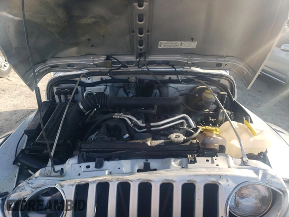 2003 Jeep Wrangler Rubicon z VIN 1J4FA69S53P375189, wystawiony jako Copart lot #54292035 z przebiegiem 55 863 mil mil oraz Szkoda całkowita • Salvage title. Historia ofert i sprzedaży dostępna na DreamBid. Obrazek 11.