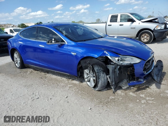 2014 Tesla Model S 60 with VIN 5YJSA1S14EFP44162, listed as a Copart auction lot 52943025 with Not Provided miles and Salvage Title. Bid and sale history available at DreamBid. Image 4.