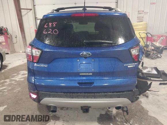 2018 Ford Escape Titanium with VIN 1FMCU9J99JUB94925, listed as a IAAI auction lot 42412800 with 95,880 mi miles and . Bid and sale history available at DreamBid. Image 17.
