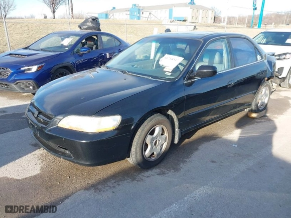 1999 Honda Accord Sdn EX with VIN 1HGCG1659XA055389, listed as a IAAI auction lot 41718327 with 216180 miles. Bid and sale history available at carsss.com. Image 2.