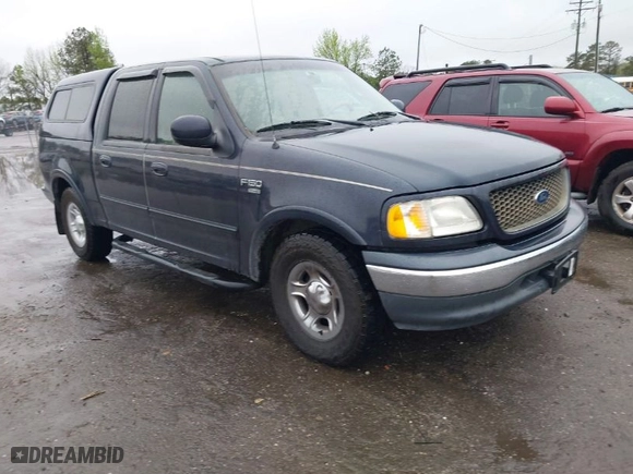 2001 Ford F-150 SuperCrew XLT with VIN 1FTRW07L41KB78053, listed as a IAAI auction lot 41965594 with 303,647 mi miles. Bid and sale history available at carsss.com. Image 1.