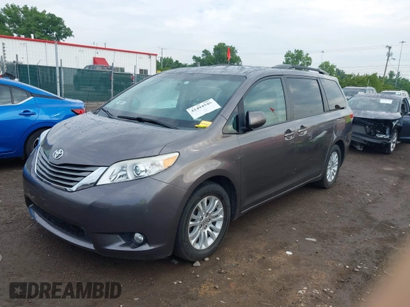 2014 Toyota Sienna XLE with VIN 5TDYK3DC0ES496716, listed as a IAAI auction lot 42494549 with 158,645 mi miles and . Bid and sale history available at DreamBid. Image 2.