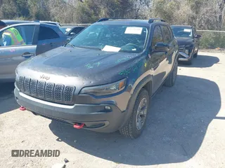 2022 Jeep Cherokee Trailhawk with VIN 1C4PJMBX4ND535037, listed as a IAAI auction lot 41779140 with 49,733 mi miles. Bid and sale history available at carsss.com. Image 2.