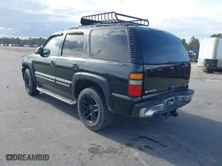 2004 Chevrolet Tahoe LT with VIN 1GNEC13ZX4J106072, listed as a IAAI auction lot 41703828 with 275,081 mi miles. Bid and sale history available at carsss.com. Image 3.