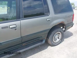 1999 Mercury Mountaineer z VIN 4M2ZU54E5XUJ25507, wystawiony jako IAAI lot #42270839 z przebiegiem 187 679 mil mil oraz . Historia ofert i sprzedaży dostępna na DreamBid. Obrazek 6.