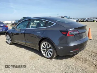 2018 Tesla Model 3 Long Range Battery z VIN 5YJ3E1EB0JF113044, wystawiony jako Copart lot #57056865 z przebiegiem 65 613 mil mil oraz Szkody całkowita. Historia ofert i sprzedaży dostępna na DreamBid. Obrazek 2.