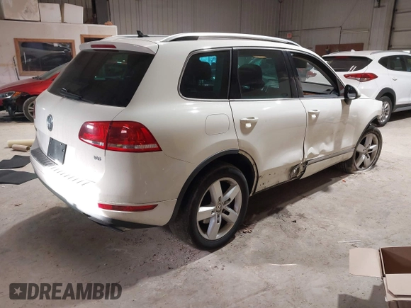 2011 Volkswagen Touareg Sport with VIN WVGFF9BP8BD004747, listed as a IAAI auction lot 41780515 with 159,228 mi miles and . Bid and sale history available at DreamBid. Image 4.