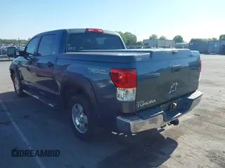 2010 Toyota Tundra with VIN 5TFEY5F11AX097360, listed as a IAAI auction lot 41990256 with 350,830 mi miles and . Bid and sale history available at DreamBid. Image 3.
