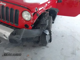 2014 Jeep Wrangler Unlimited Sahara z VIN 1C4BJWEGXEL179054, wystawiony jako IAAI lot #42151597 z przebiegiem 151 810 mil mil oraz . Historia ofert i sprzedaży dostępna na DreamBid. Obrazek 6.