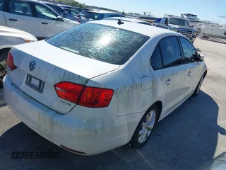 2012 Volkswagen Jetta Sedan SE w/Convenience with VIN 3VWDX7AJ2CM367784, listed as a IAAI auction lot 41386552 with 104,744 mi miles. Bid and sale history available at carsss.com. Image 4.