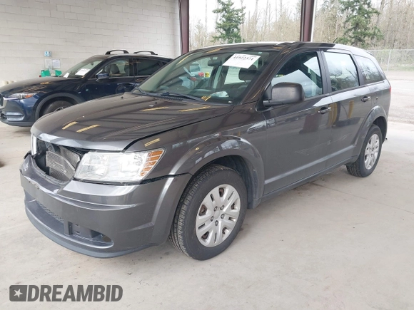 2015 Dodge Journey SE z VIN 3C4PDCAB1FT617794, wystawiony jako IAAI lot #41922371 z przebiegiem 130 558 mil mil oraz . Historia ofert i sprzedaży dostępna na DreamBid. Obrazek 18.